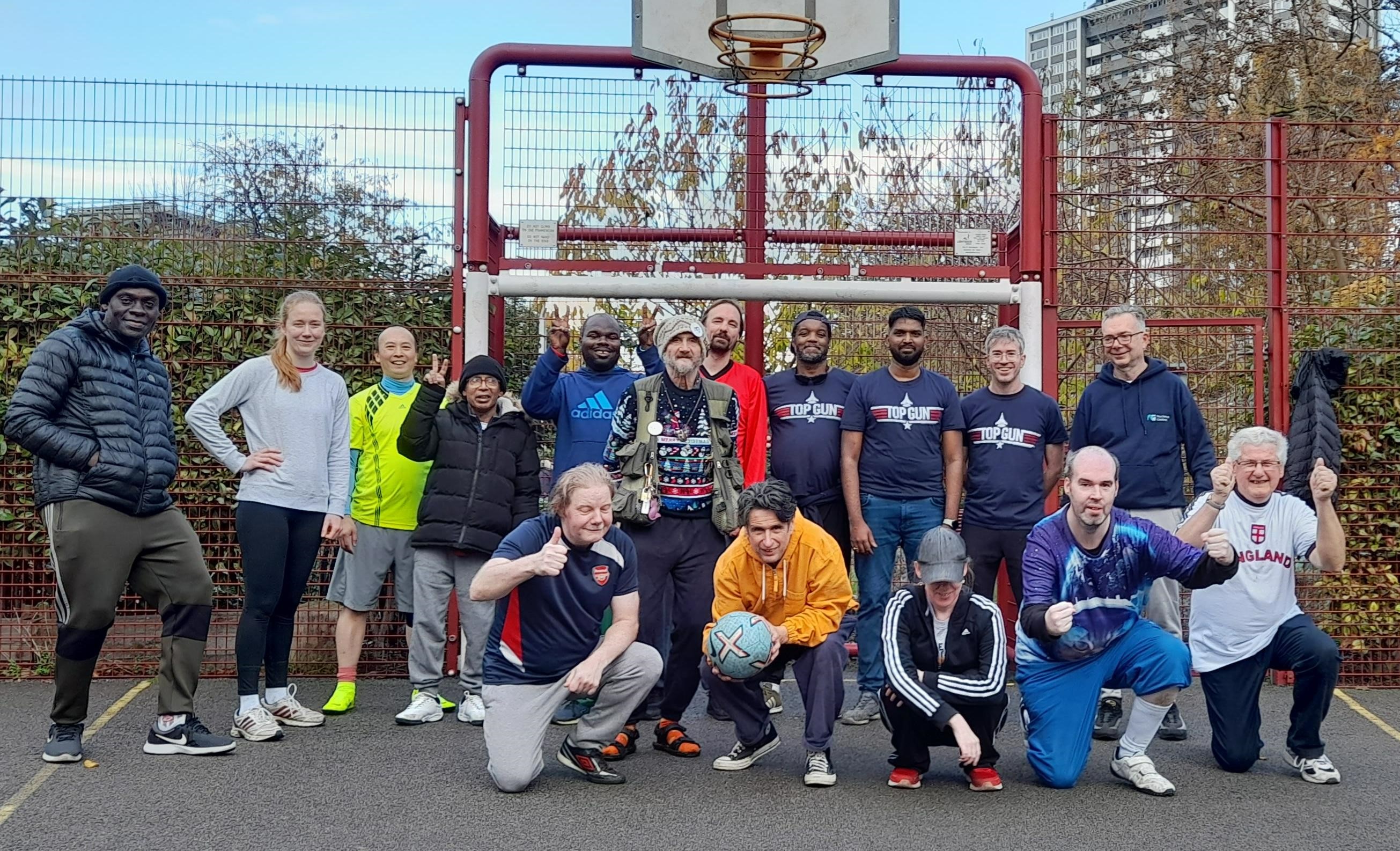 A group of volunteers in a basketball court