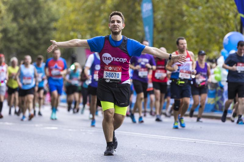 Mencap runner with his arms out